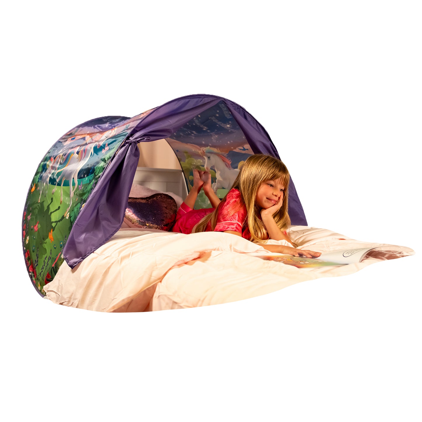 Child reading under a purple unicorn-themed Dream Tent bed canopy.